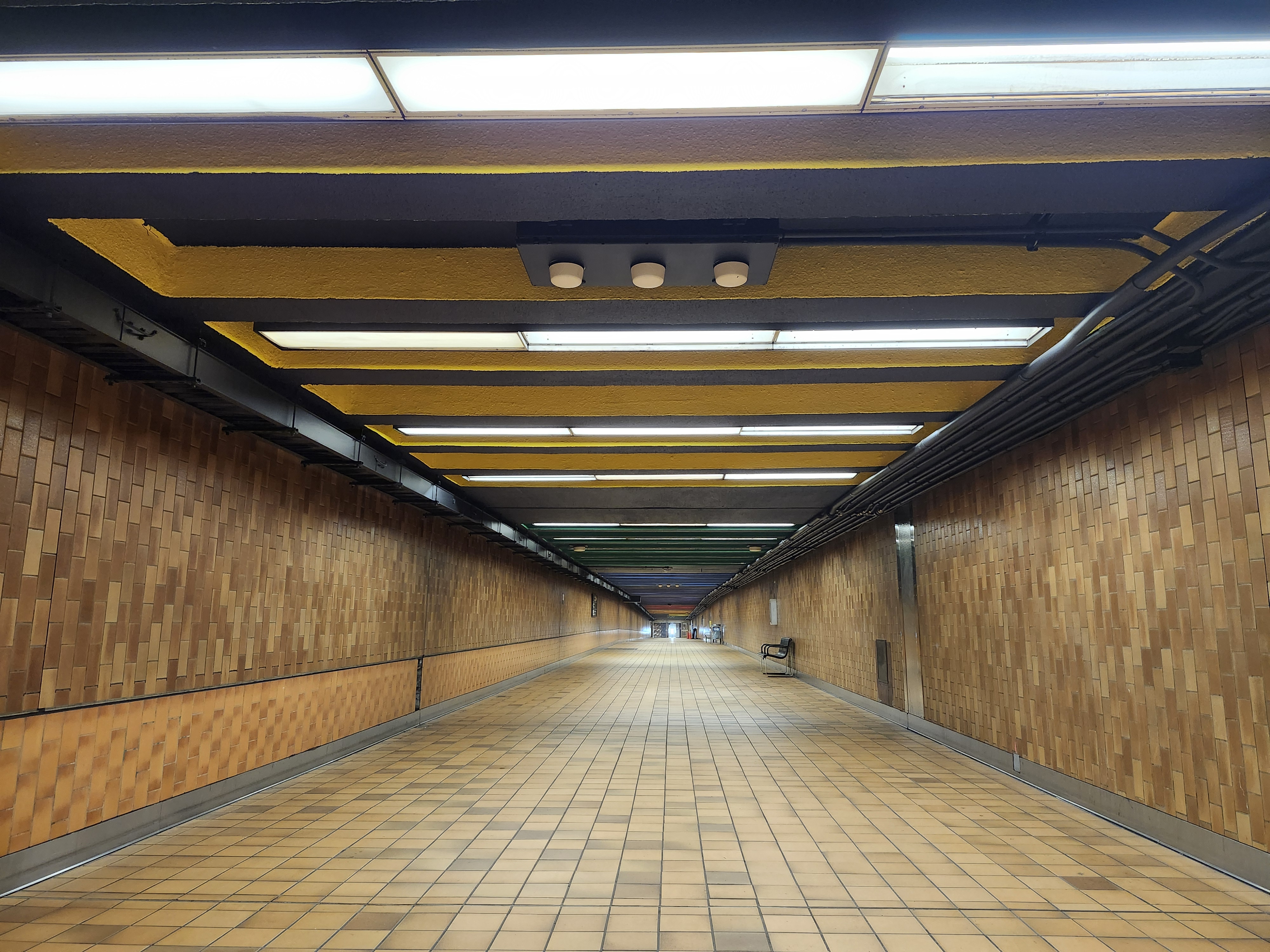 Image of Spadina Station pedestrian walkway ceiling after some improvements