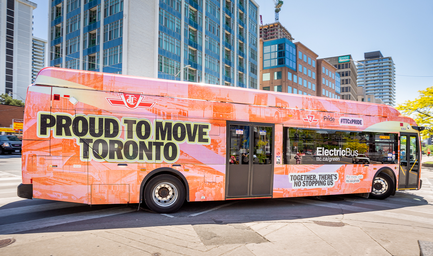 The TTC's 2026 Pride Bus with the text "Proud to Move Toronto," and other text featuring important milestones in the TTC and Toronto's history such as "Sexual orientation explicitly protected in TTC's equal opportunity policy in 1989