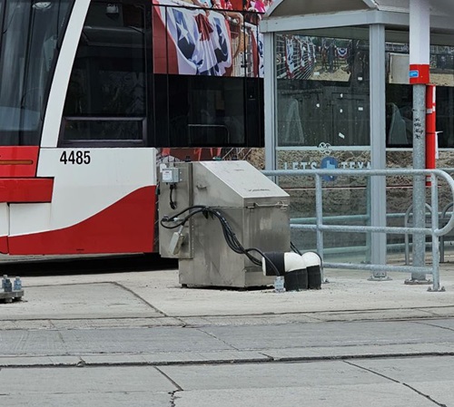 image of in ground lubricator with streetcar in the background