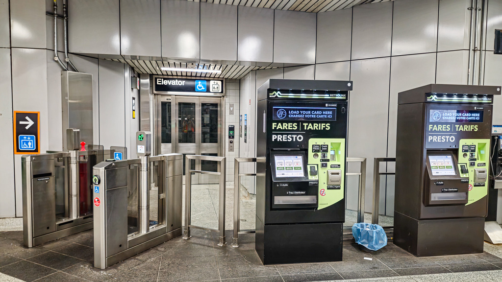 Two PRESTO vending machines beside a fare gate