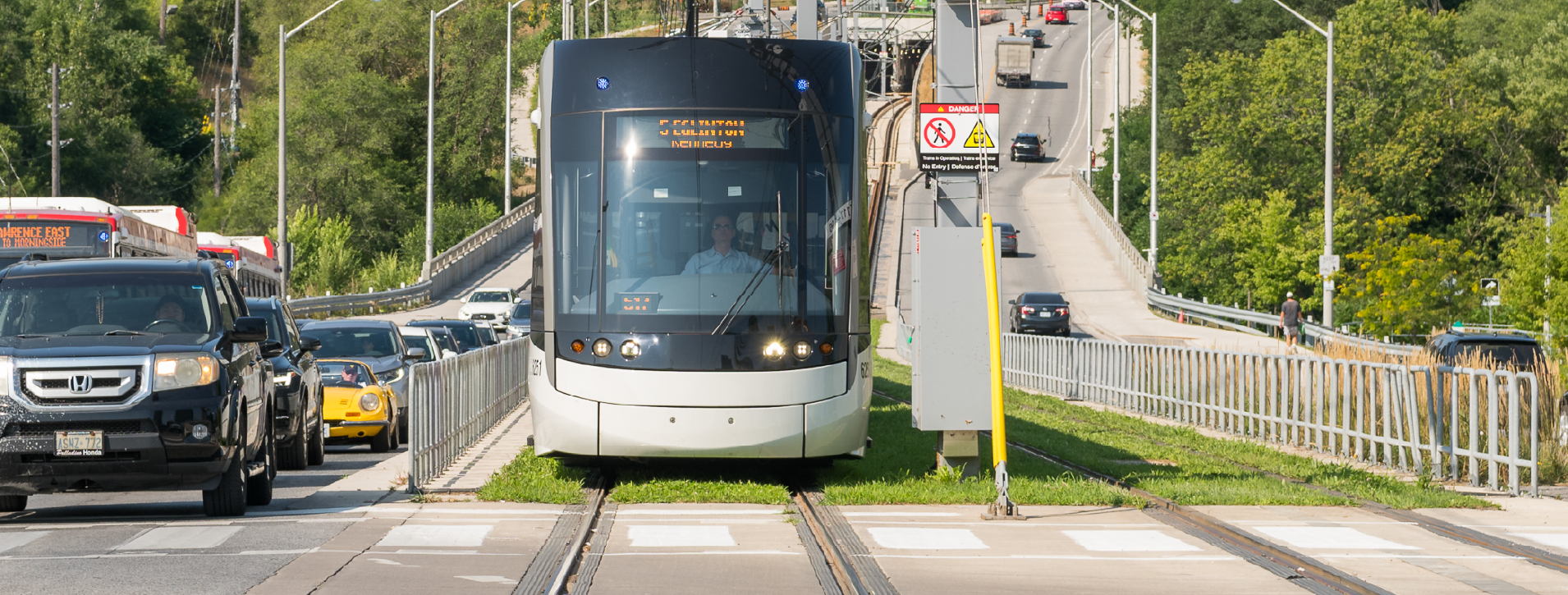 Line 5 light rail vehicle traveling along Eglinton Avenue East