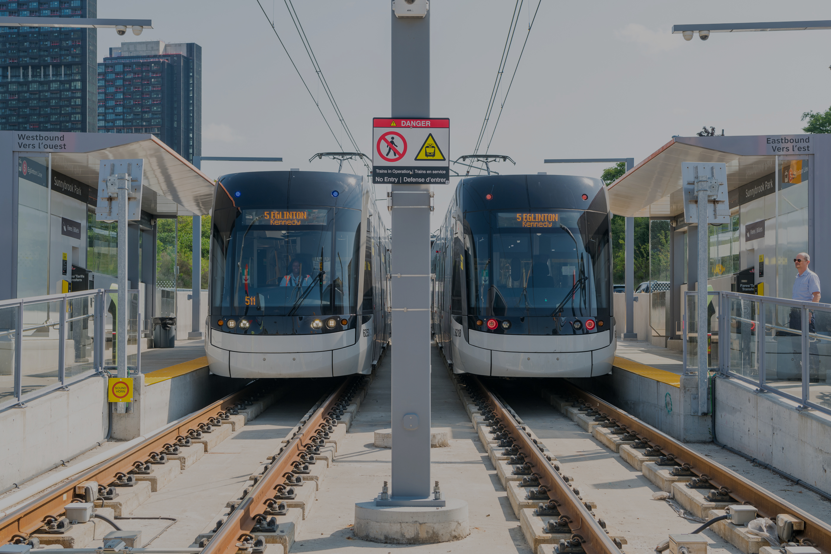 Two TTC Line 5 cars stopped at a station.