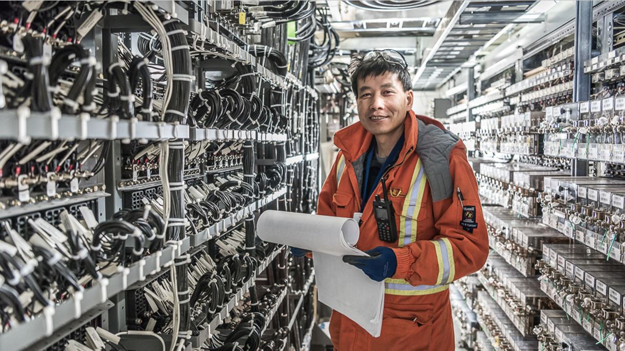 Engineer pictured with a bank of wiring 