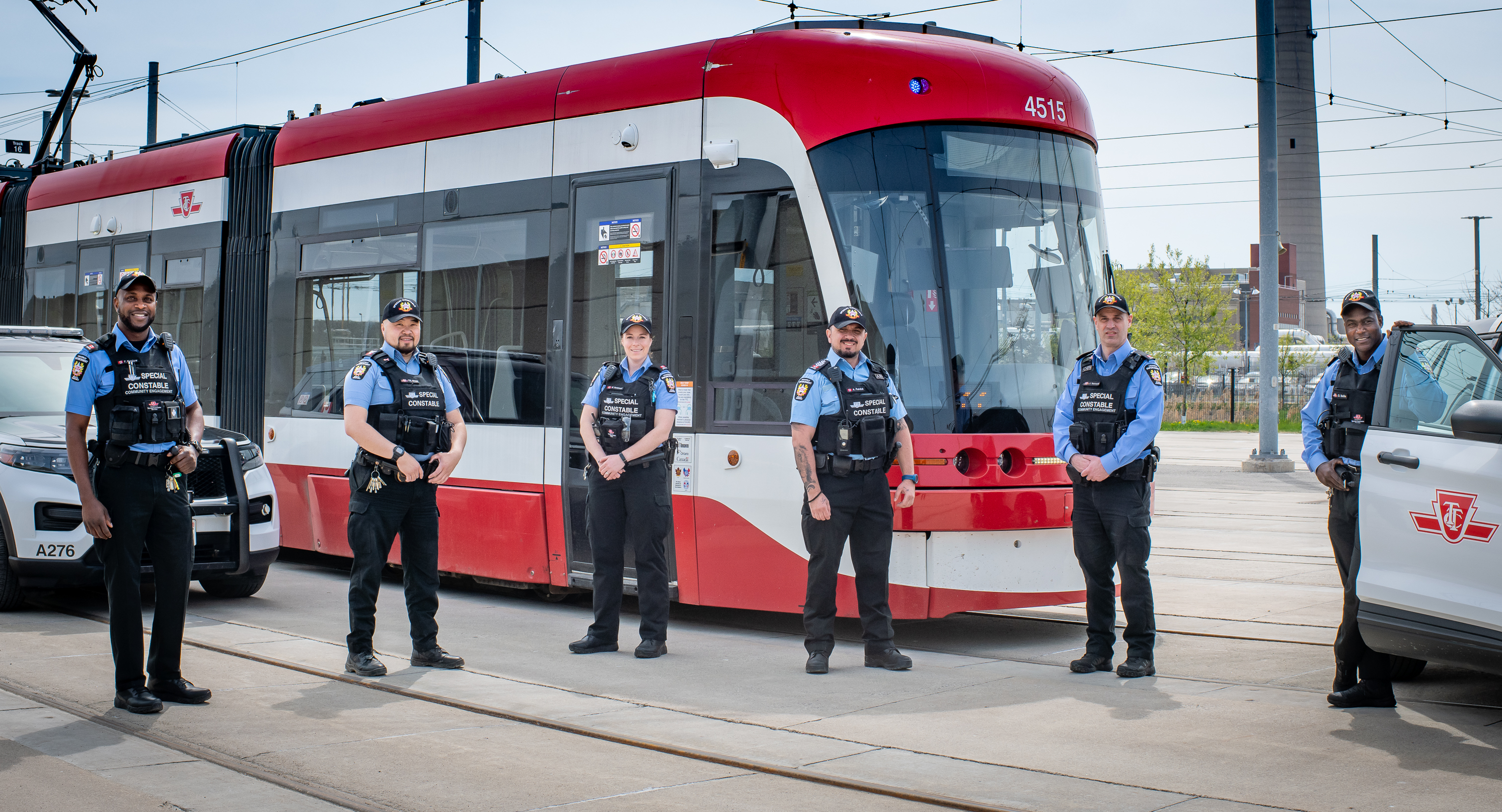Special constables standing with a TTC streetcar
