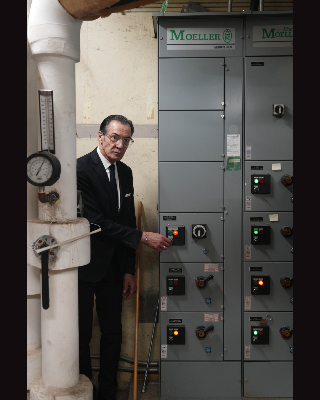 Man standing in front of a control panel