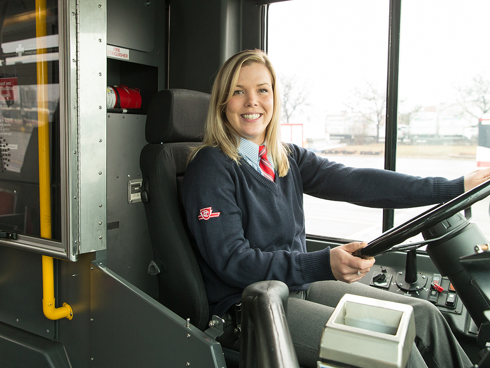 TTC driver behind the steering wheel of a bus