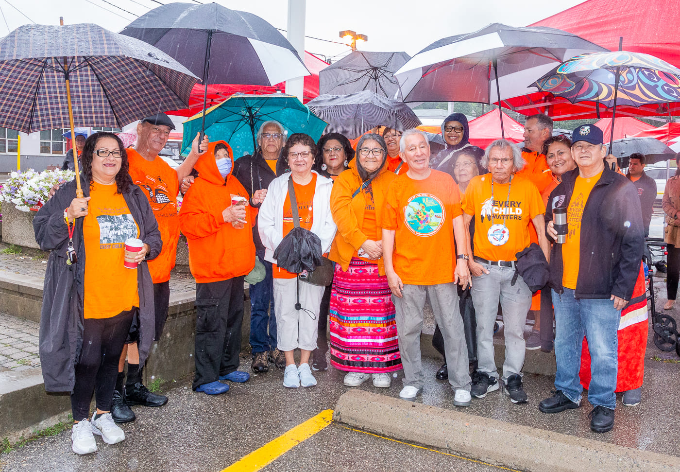 Members of the ATU 113 United Indigenous Council and the Residential School Survivors Group from Toronto Council Fire wearing orange shirts.