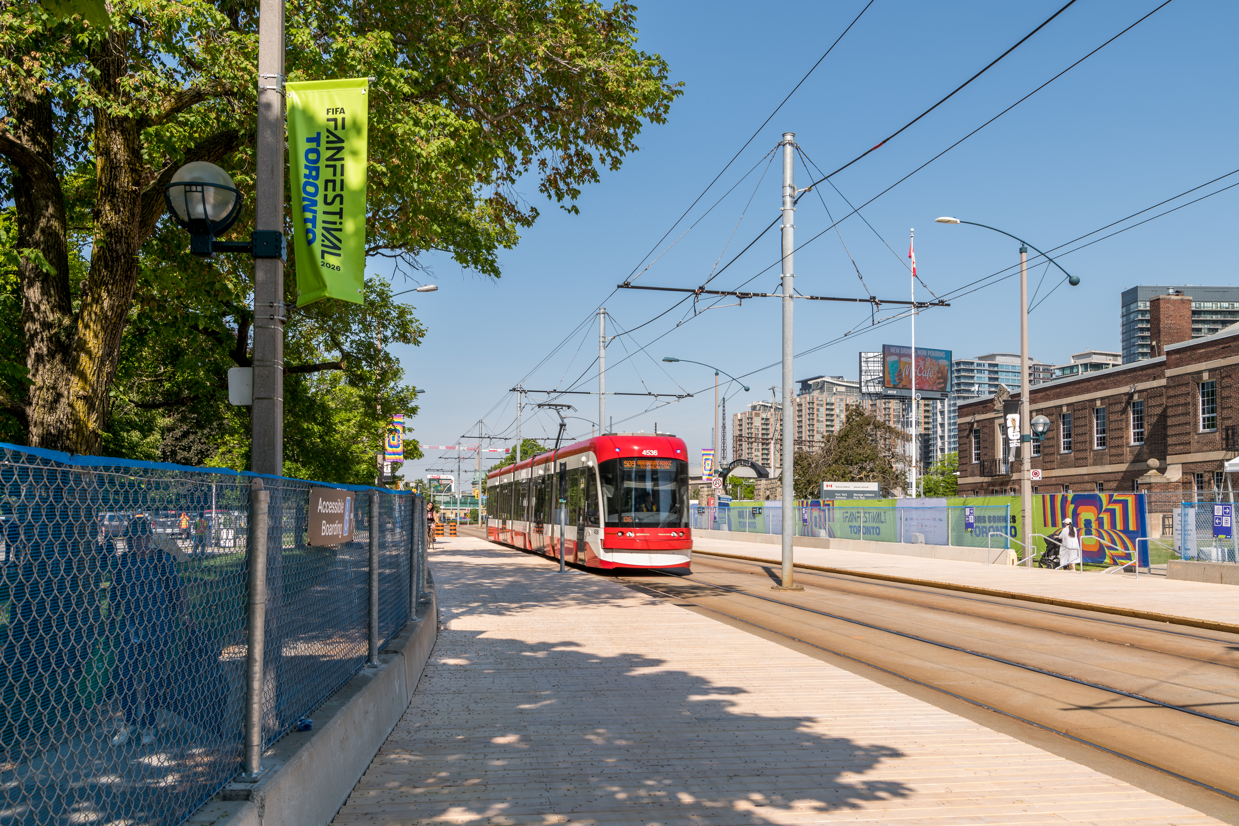 A TTC streetcar pulling into Fleet Hub, with two sets of tracks and platforms on either side