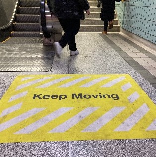 "Keep Moving" floor markings at a TTC subway station