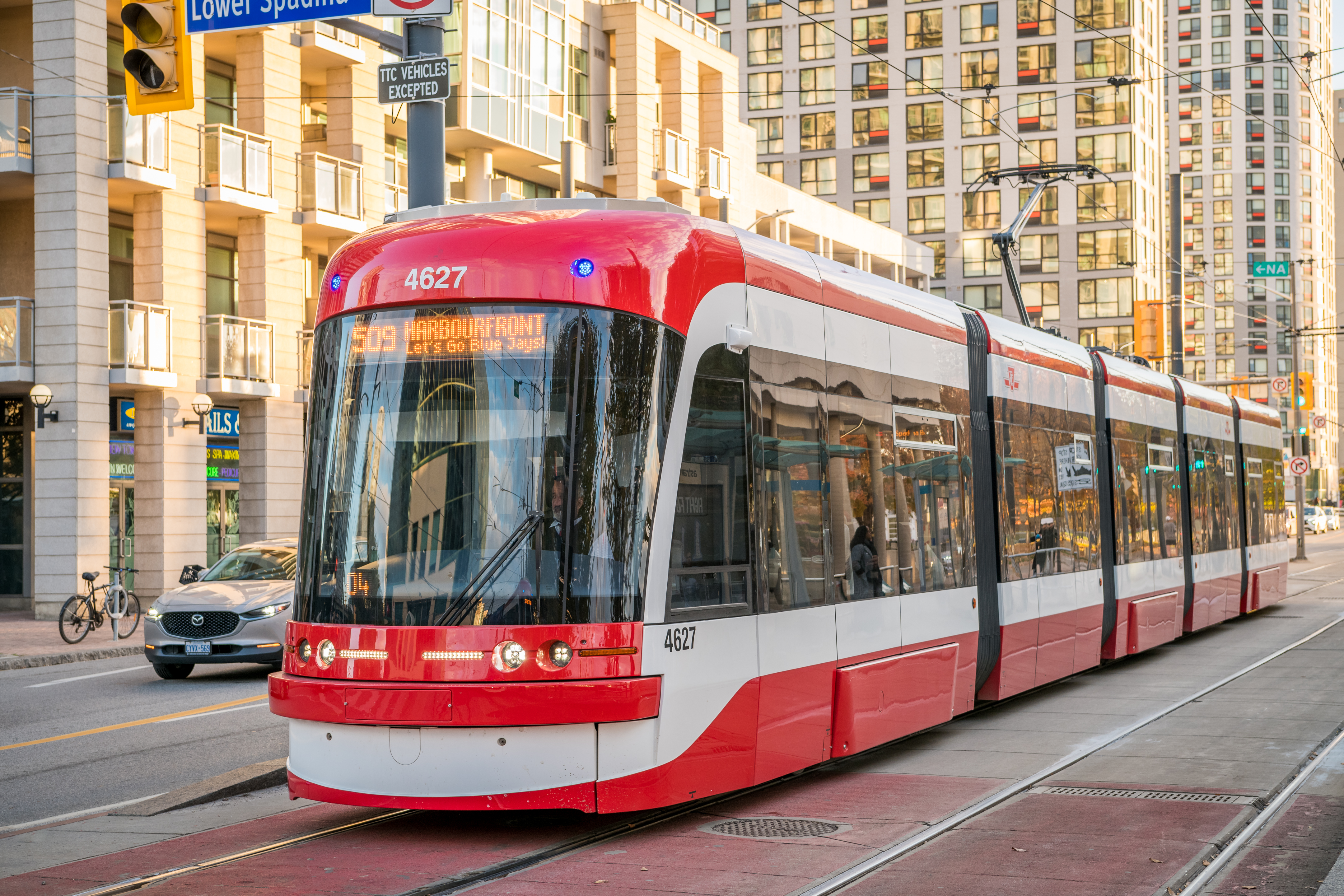 TTC Streetcar with a 'Let's Go BlueJays' sign.