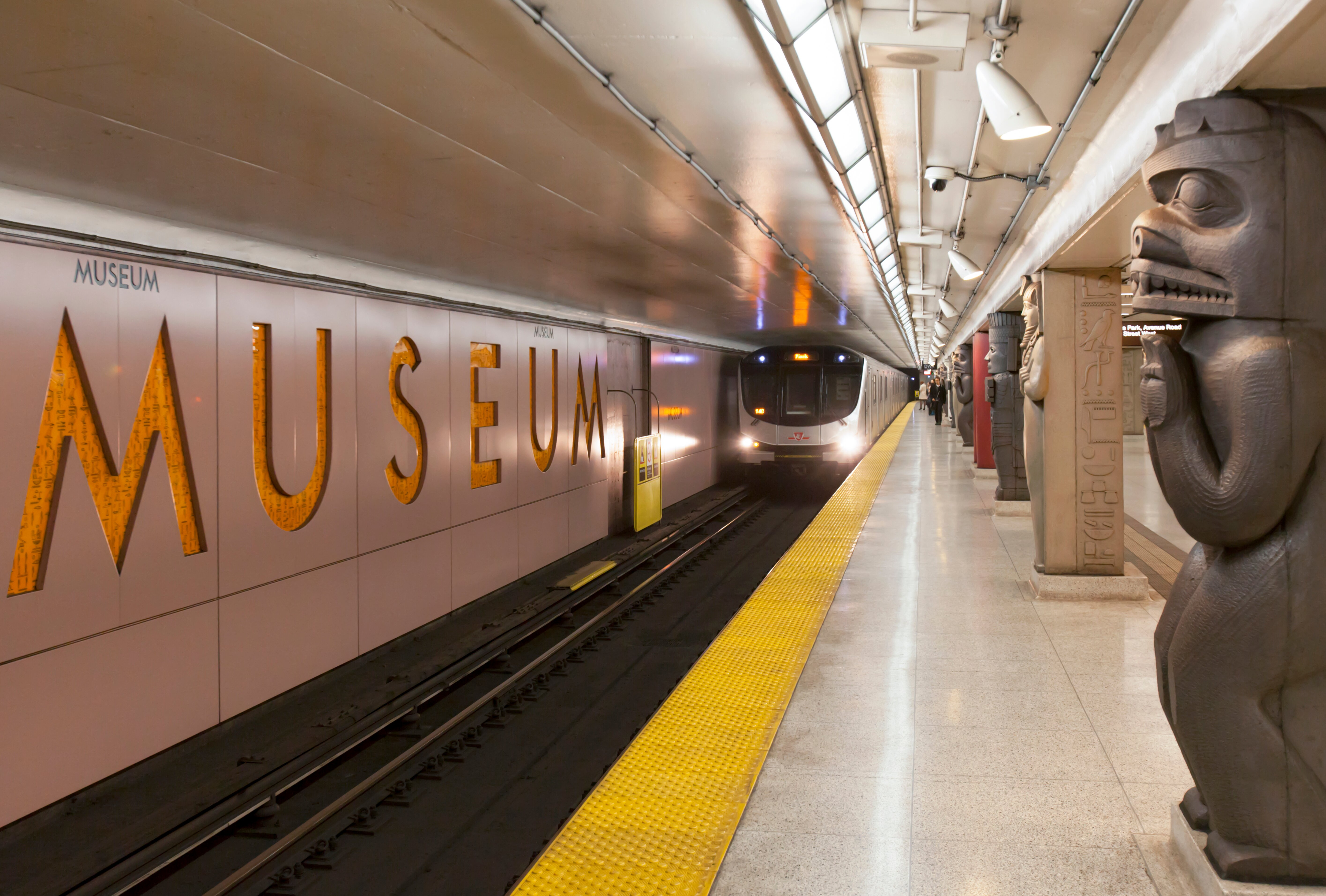 Museum subway station with an approaching subway train.