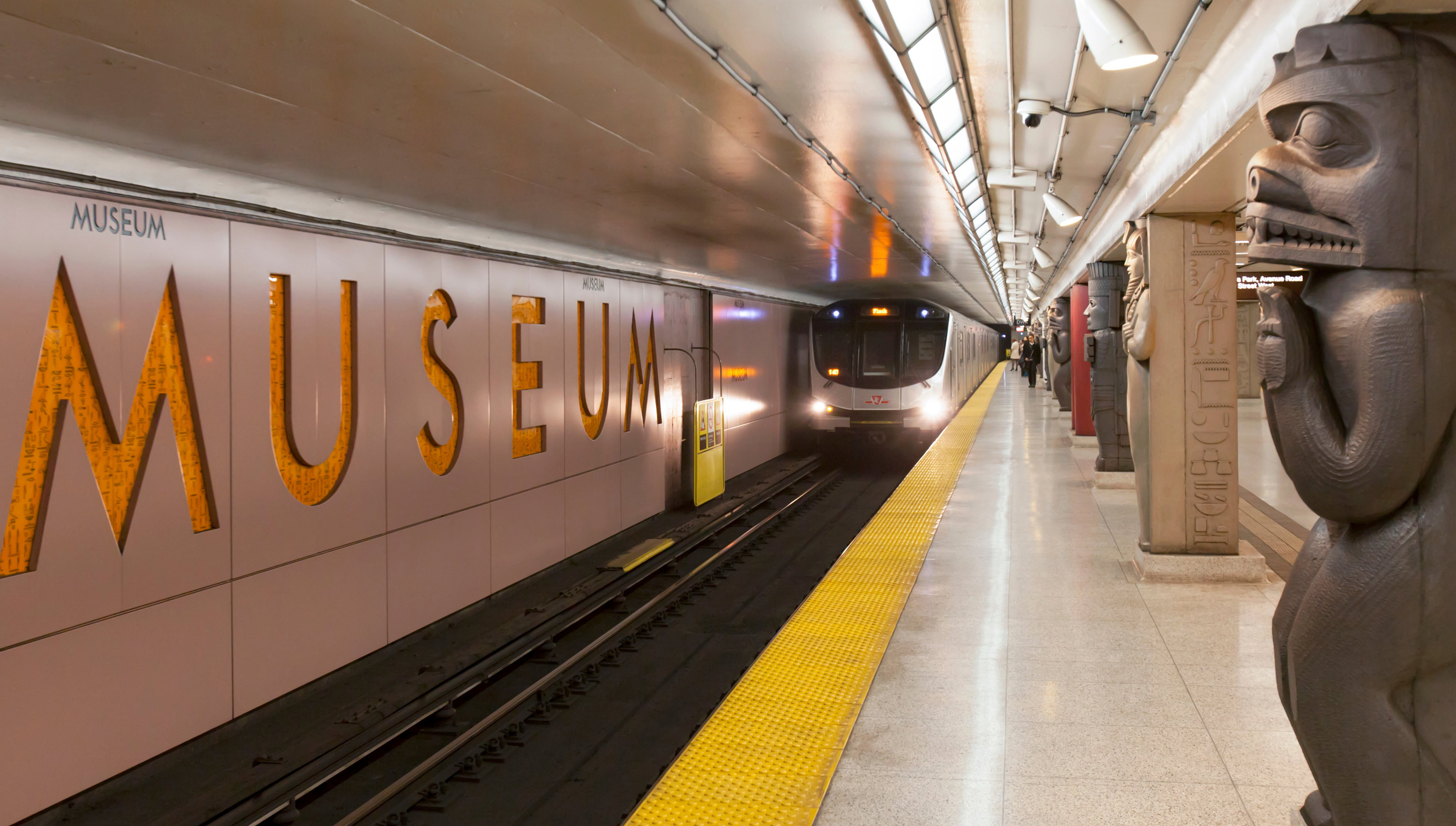 Museum subway station with an approaching subway train.