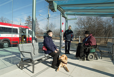 Customers in seating area of Access Hub with TTC operator entering