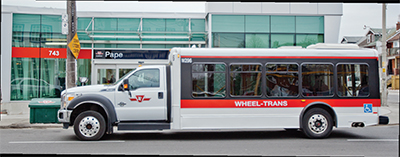 Wheel-Trans vehicle parked in front of Pape Station