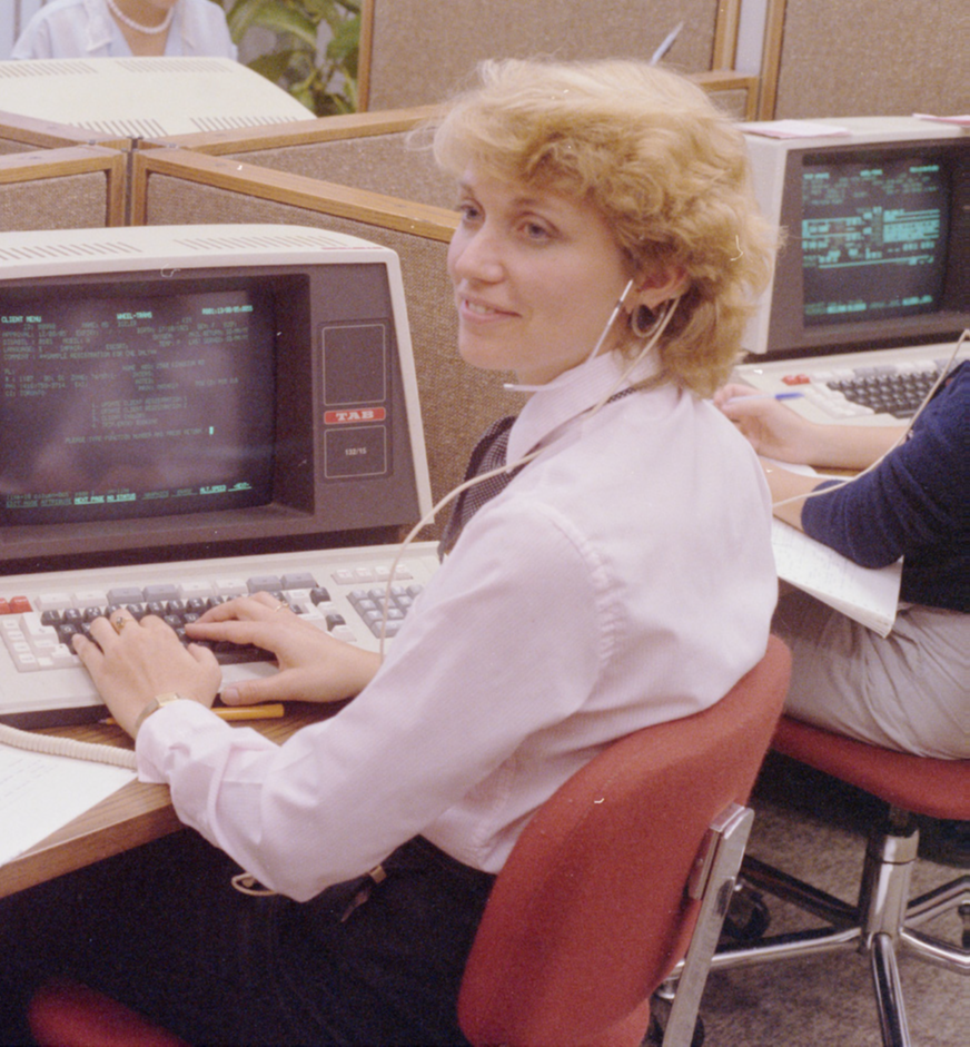 A staff member of the Wheel-Trans Reservations and Scheduling team