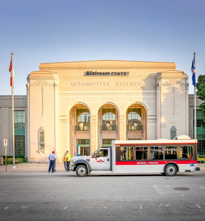 A Wheel-Trans bus is stationed outside the Automotive Building at 105 Princes’ Boulevard