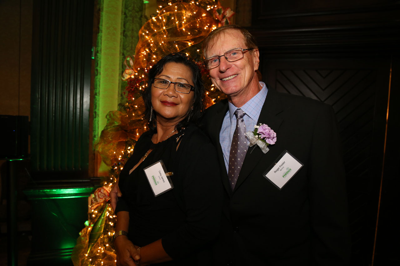 ROGER FOSTER, 27 years, 10 months From Bus Maintenance and Shops, Roger Foster with his wife, Cetia.