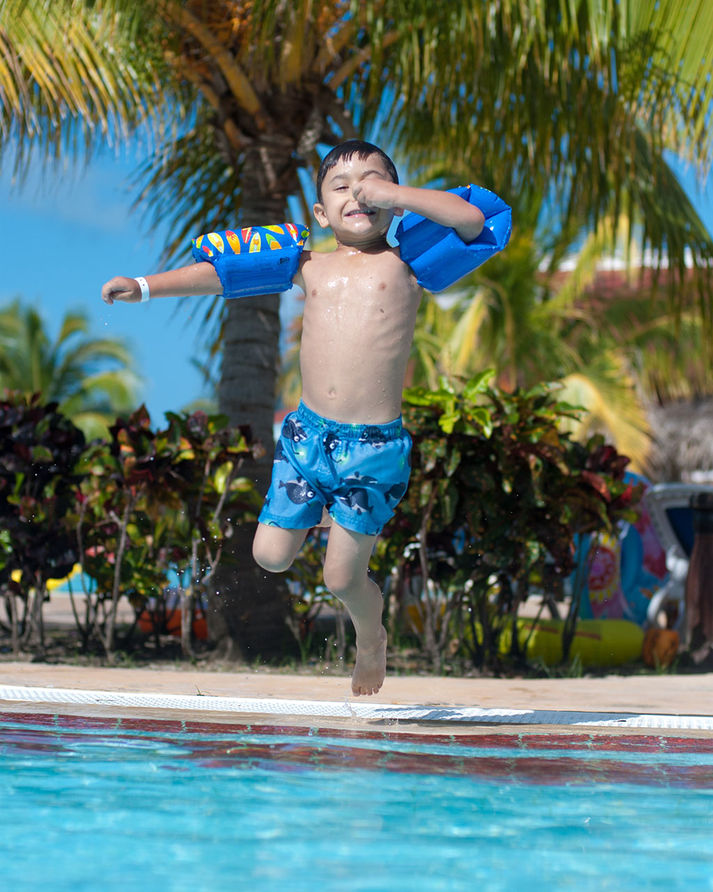 Bombs away! My four year old son, Joshua, jumping into the pool in Cuba. Photo courtesy Mike Macas, Technical Support Services