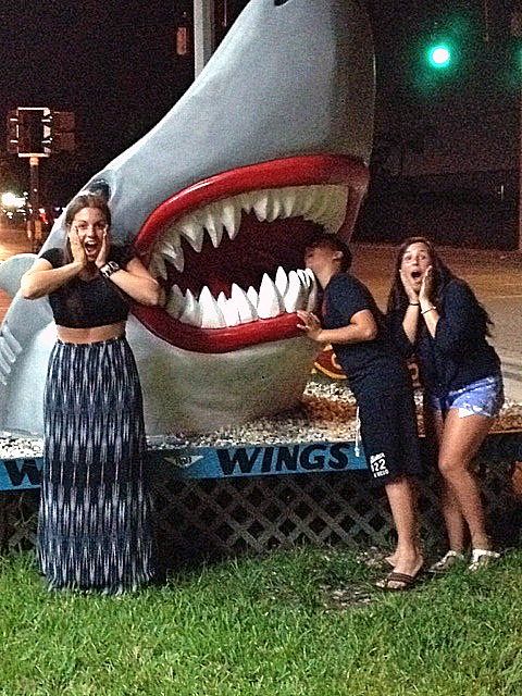 Felicia, Adamo and Julia in Fort Lauderdale outside the Wings store during Shark Week.Photo courtesy Bruna Augurusa, Investigative Services