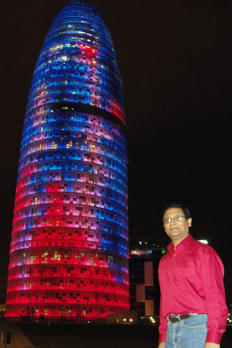 In front of Torre Agbar, 38 storey skyscraper in Barcelona, Spain. Photo courtesy Salek Seraj