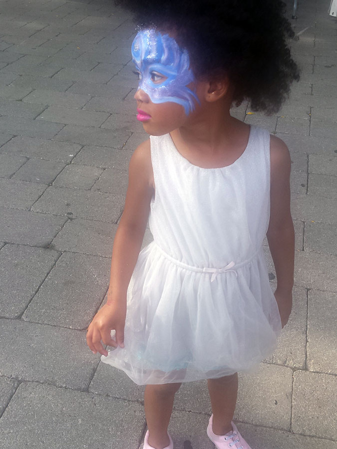 Gabby, 3, at Harbourfront Centre, Island Soul Festival, face painted in Carnival half mask. Photo courtesy Veronica Antipolo