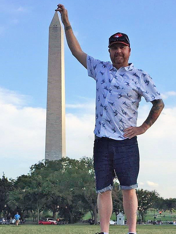 Touching the top of the Washington Monument. Photo courtesy Stuart Green