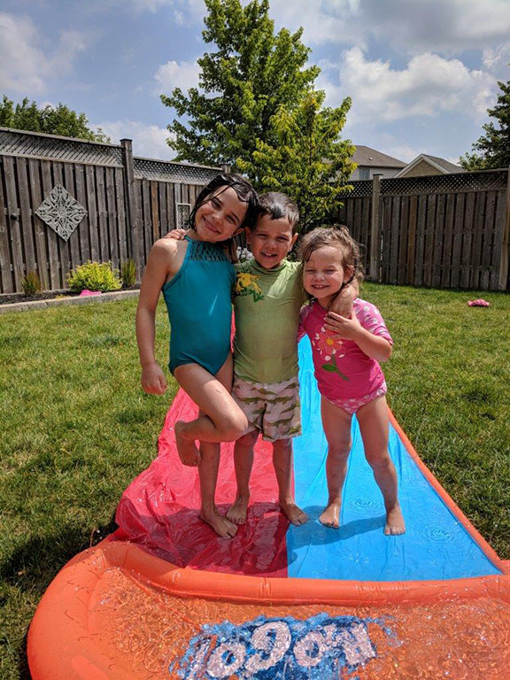 My kids, Rayah, Noah and Avah posing on their slip and slide. Photo courtesy Shawn Silva
