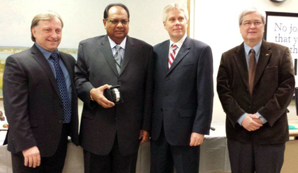 Recipient: Customs/Tax Analyst Nash Lalji, second from left, was congratulated on a quarter century of service with the Commission. Location: Treasury Services in Finance. Congratulated by: Chief Financial and Administration Officer Vincent Rodo, left, Chief Financial Officer Michael Roche, second from right, and Treasury Services Director Ralph Richardson, right.