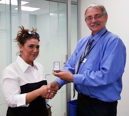 Recipient: Project Administrative Secretary Hasiba Anna Esmatyar receives her 15 year pin. Location: Streetcar Engineering. Congratulated by: Chief Engineer Greg Ernst.