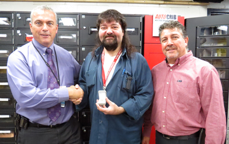 Recipient: Escalator Mechanic Robert DeSantis, centre, was congratulated on three decades of service with the TTC. Location: Escalating Devices in Plant Maintenance. Congratulated by: Head Glen Buchberger, left, and Supervisor Frank Cannella, right.