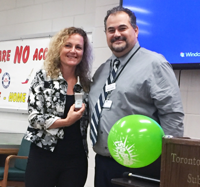 Recipient: Fleet Management Coordinator Pia Zonni accepts her 30 year long-service pin. Location: Rail Cars and Shops. Congratulated by: Head Raffaele Trentadue.