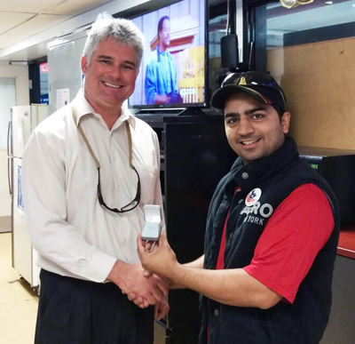 Recipient: Mechanical Serviceperson Mohsin Patel, right, receives his 5-year pin. Location: Lakeshore Garage. Congratulated by: Manager Bruce Peters.