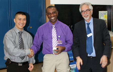 Recipient: Foreperson Robbie Roberts, centre, was congratulated on four decades of service with the TTC. Location: Harvey Shop. Congratulated by: Chief Operating Officer Gary Shortt, right, and Bus Maintenance and Shops Head Rich Wong, left.