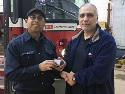 Recipient: Rail Vehicle Analyzer Anacleto Lopez, left, was presented with his 10 year milestone pin. Location: Russell Carhouse. Congratulated by: Night Shift Foreperson Joe Perruccio, right.