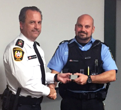Recipient: Transit Enforcement Officer Steve Richards, right, receives his 10 year pin. Location: Transit Enforcement Unit. Congratulated by: Chief Special Constable Mark Cousins, left.