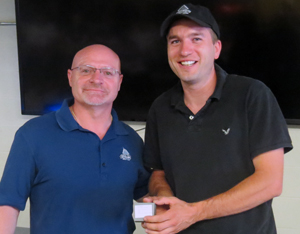 Right: Escalator Mechanic Ryan Mabee, 5 years  congratulated by Foreperson John Sciarra.