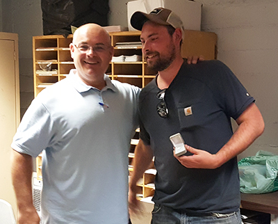 Recipient: Escalator Mechanic Michael Bunja, right, received his five year pin. Location: Plant Maintenance Department. Congratulated by: Foreperson Tom Lengyel, left.