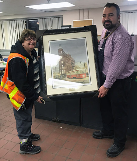 Recipient:  Car house Operator Theresa Bedford celebrated 25 years of service with the TTC. Location: Wilson Carhouse. Congratulated by: Rail Vehicles Manager, Ante Misetich.