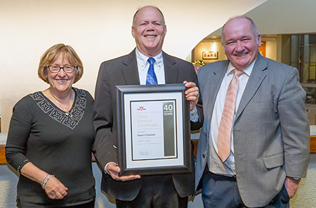 40 years of service: Subway Supplier Robin O’Donnell, with his wife, Eva, and friend, Dr. Roy Sommerville. Department: Revenue Operations.