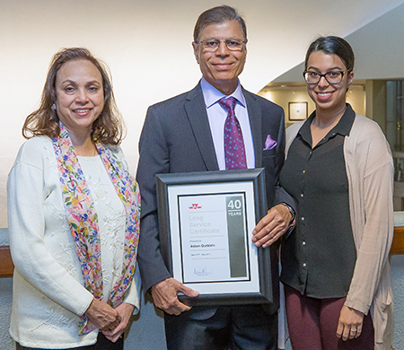 40 years of service: Queensway Garage Coach Technician Aslam Quraishi, with his wife, Sabiha, and daughter, Anan. Department: Bus Maintenance and Shops.