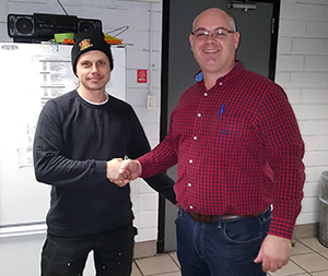 Recipient: Escalator Apprentice Matthew Perovic, left, received his five-year milestone pin. Location: Plant Maintenance, Elevating Devices. Congratulated by: Foreperson Tom Lengyel, left.