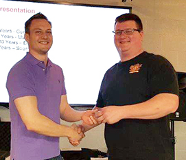 Recipient: Escalator Apprentice Michael Preston, right, accepted his 10 year milestone pin. Location: Plant Maintenance Department. Congratulated by: Foreperson Matthew D’Amore, left.