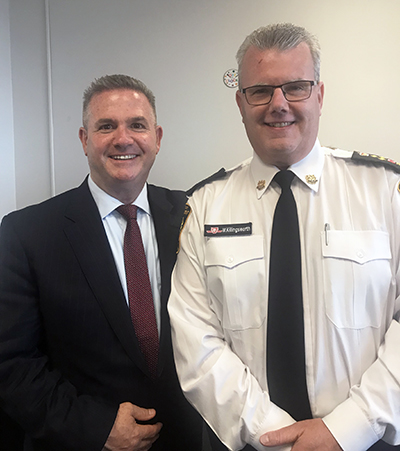 Recipient: Transit Enforcement Head Mike Killingsworth, right, celebrated three decades of service at the Commission. Location: McBrien Building. Congratulated by: Acting CEO Rick Leary, left.