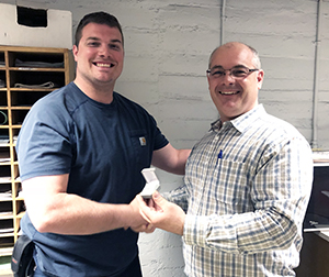 Recipient: Escalator Mechanic Kevin Weston, left, received his five-year pin. Location: Plant Maintenance Department. Congratulated by: Foreperson Tom Lengyel, right.
