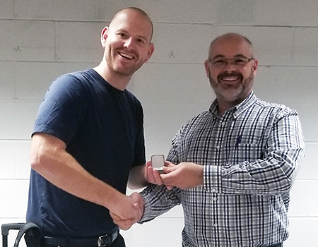 Recipient: Escalator Mechanic Gary Dowle, left, received his five-year pin. Location: Elevating Devices Section in Plant Maintenance. Congratulated by: Foreperson Tom Lengyel, right.