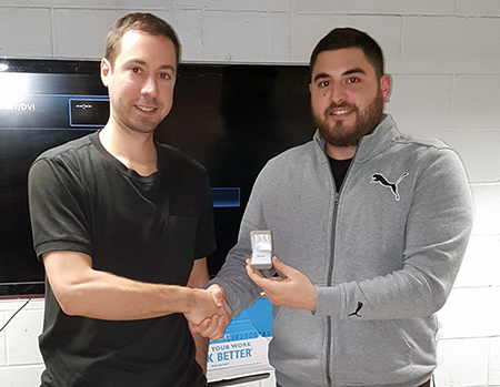 Recipient: Escalator Mechanic Luke Van Dusen, left, received his five-year pin. Location: Elevating Devices Section in Plant Maintenance. Congratulated by: Foreperson Foreperson Joe Schiralli, right.