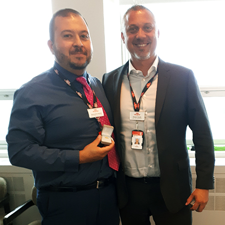 Recipient: Divisional Manager Giancarlo Fiorino, left, received his 20-year long-service pin. Location: Bus Transportation Department. Congratulated by: Head Robert Smith, right.