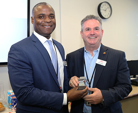 Recipient: Acting Chief Service Officer Collie Greenwood, left, was congratulated on his 30th anniversary of service at the Commission. Location: McBrien Building. Congratulated by: CEO Rick Leary, right.