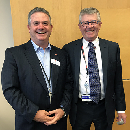 Safety and Environment Head John O’Grady, right, accepted his 20-year milestone pin from CEO Rick Leary, left.