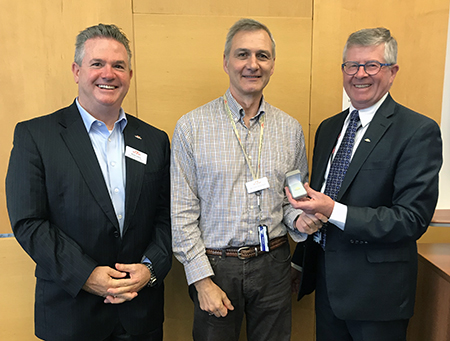 Occupational Hygienist Bill Swanson celebrated was thanked and recognized for 30 years of service with the TTC. Presenting him with his long-service pin was CEO Rick Leary, left, and Safety and Environment Head John O’Grady, right.